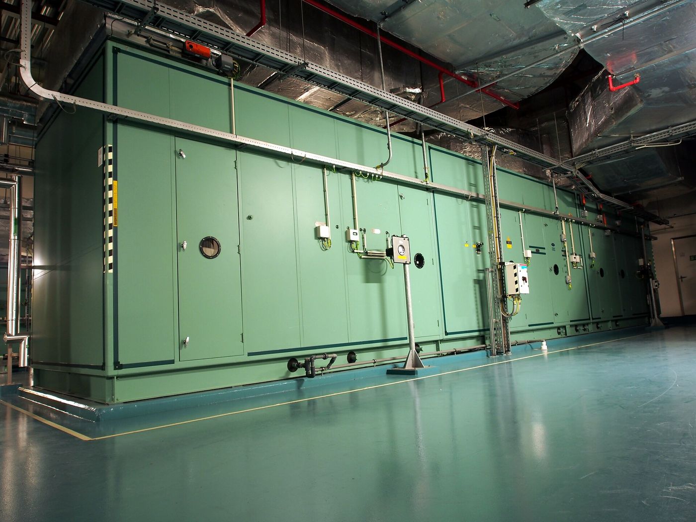 Large commercial air handling unit in a mechanical plant room