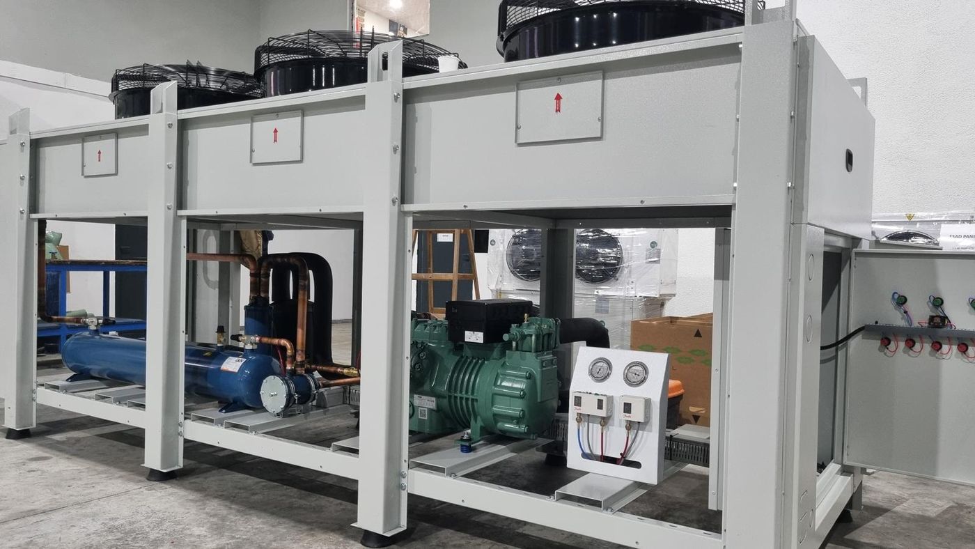 Refrigeration condensing unit for a walk-in cooler